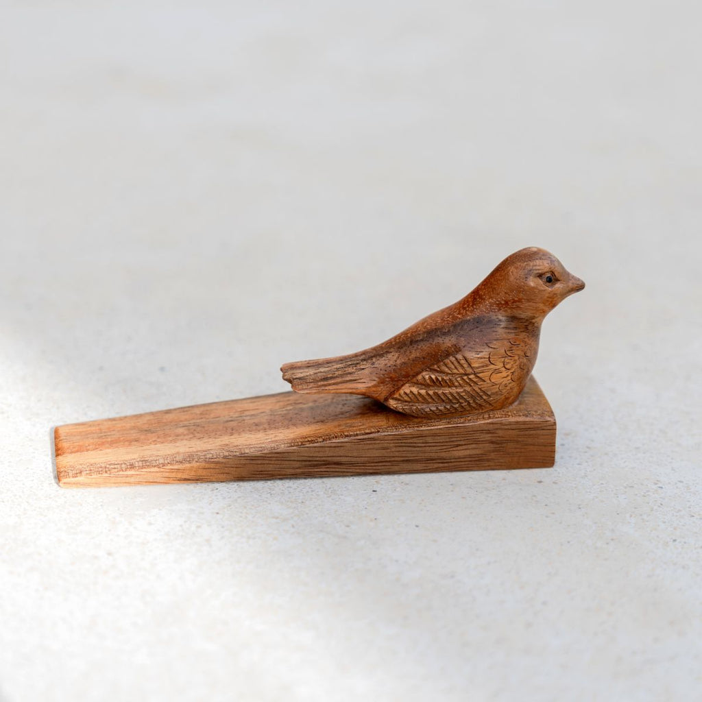 Cale-porte en forme d'oiseau